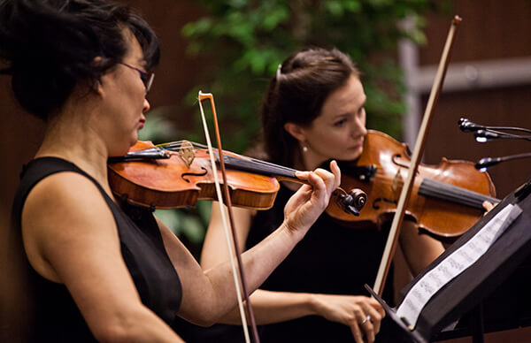 MaRSian Melissa Hughes (right)  and the Toronto Orchestra play at the ceremony