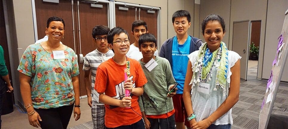 Another cohort group showing off their prototype